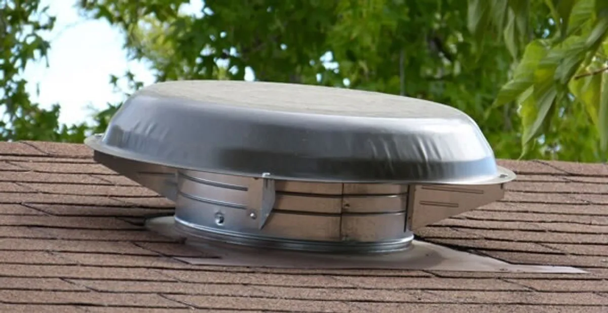 attic fan installation services with low-profile roof ventilation unit in Cambridge, MA