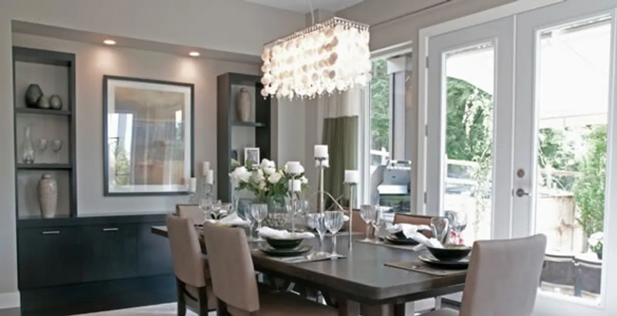 Elegant dining room chandelier installation above table in Cambridge, MA