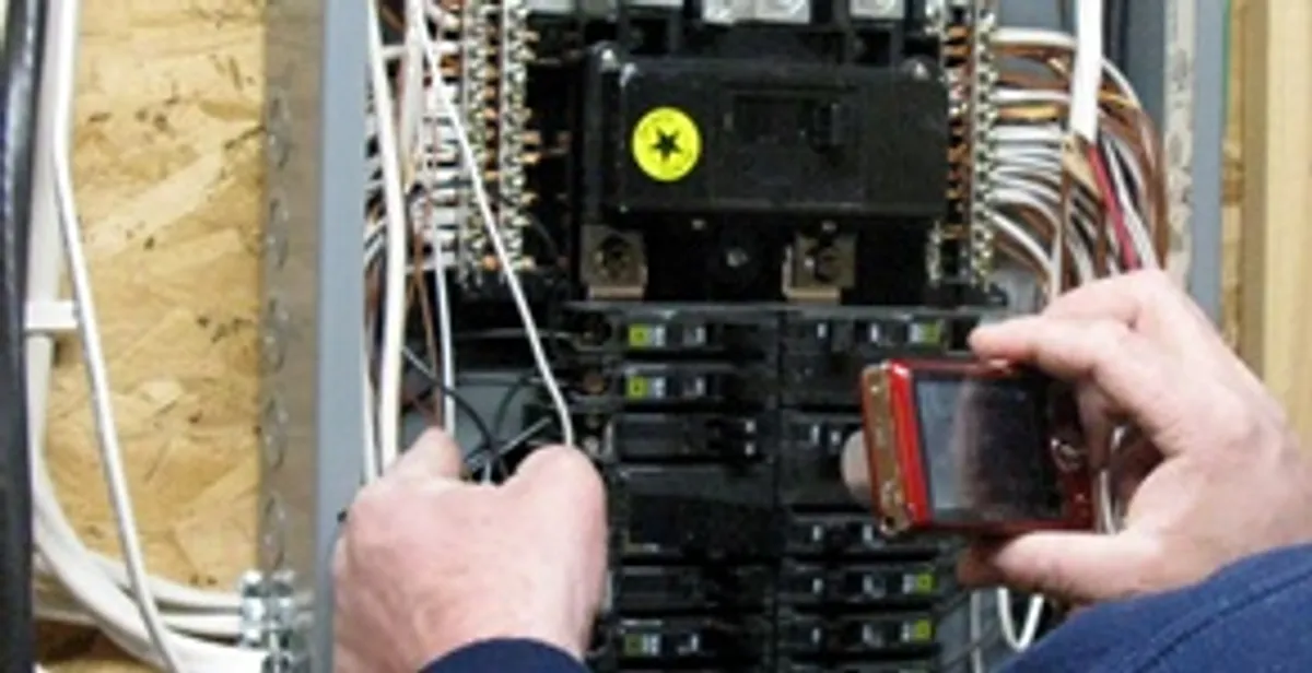Home electrical inspection of circuit breaker panel by licensed electrician in Cambridge, MA