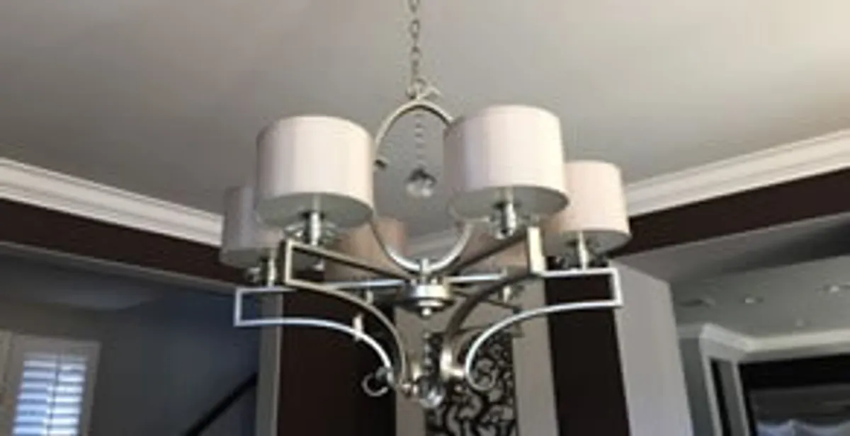 Modern chandelier installation with multiple light fixtures in Cambridge, MA
