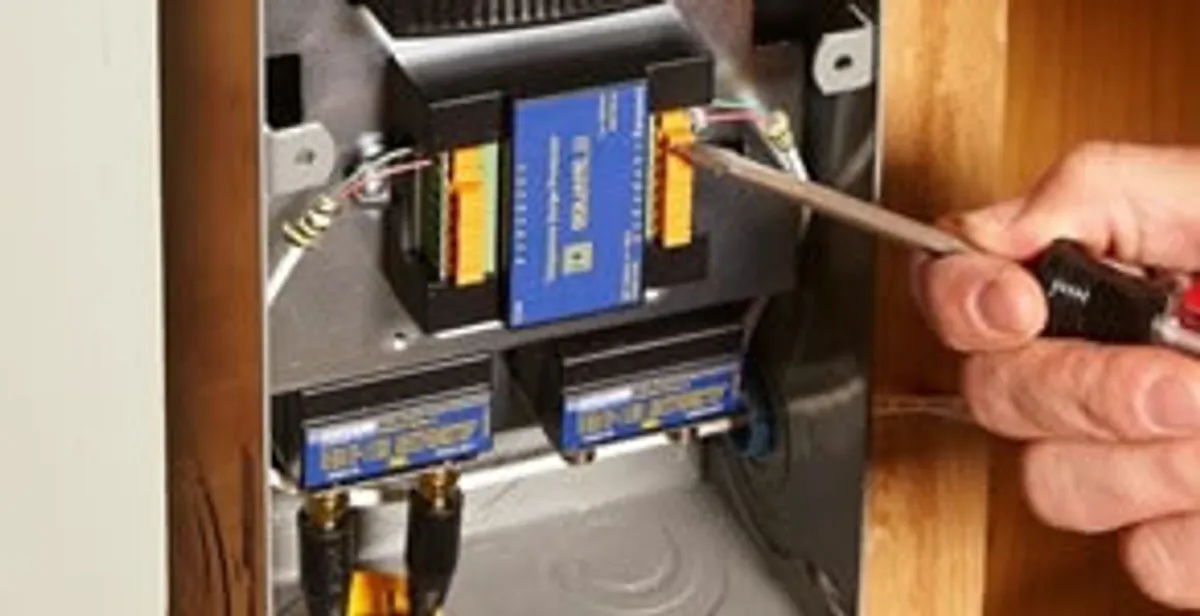 Whole home surge protection device being installed by a licensed electrician to protect electrical systems in Cambridge, MA